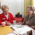 Besuch bei Klientin im Wohnzimmer