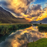 zu sehen ist ein Sonnenuntergang über einen Tiroler Bergsee