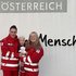 Rotkreuz-Pärchen mit Kind