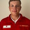 Herr Christoph Peinhaupt in Rotkreuz-Uniform vor weißem Hintergrund.