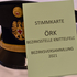 Rotkreuz-Tellerkappe mit Stimmzettel für die Knittelfelder Bezirksversammlung 2021 davor.