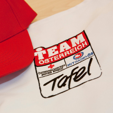 Team Österreich Tafel - © ÖRK/Nadja Meister Team Österreich Tafel, Auf dem Bild eine Kappe mit Logo