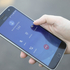 zu sehen ist ein Mobiltelefon, auf der eine Person den Notruf 144 eintippt