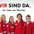 Rotkreuz-Mitarbeiter:innen auf dem Sujet der Imagekampagne "Wir sind da"