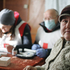 Ukraine, Nelipiwka, November 2019. Wera Parnizkaja sitzt in der mobilen Klinik des Roten Kreuzes. Seit 2014 herrscht hier ein bewaffneter Konflikt, der dazu führte, dass es in dieser Region keine Ärzte mehr gibt. Die einzige Versorgung, die es gibt, ist eine mobile Klinik, die das Rote Kreuz organisiert – mitfinanziert von der Österreichischen Agentur für Entwicklungszusammenarbeit (ADA). Zwei Mal im Monat kommen ein Arzt und zwei Pflegerinnen, die sich der PatientInnen annehmen. Sie bieten freie medizinische Behandlung und Medikamente. Querformat.