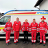 5 Personen vor einem RTW.