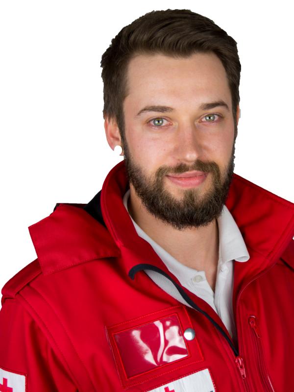 Ing. Christian Schlick - © St. Andraschko / Rotes Kreuz Steiermark Ing. Christian Schlick im Porträt in roter Rotkreuz-Uniformjacke vor weißem Hintergrund.